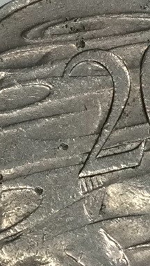 Shallow-Holes-On-20-Cent-Coin