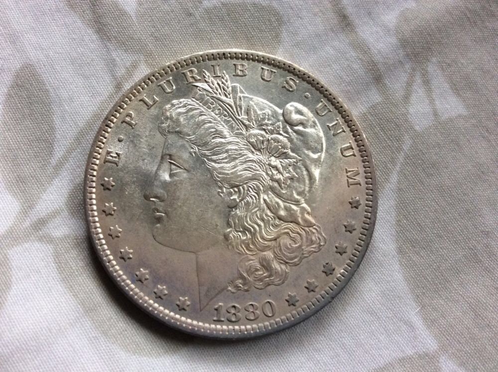 1880-O-Morgan-For-Grading-In-Hand.
