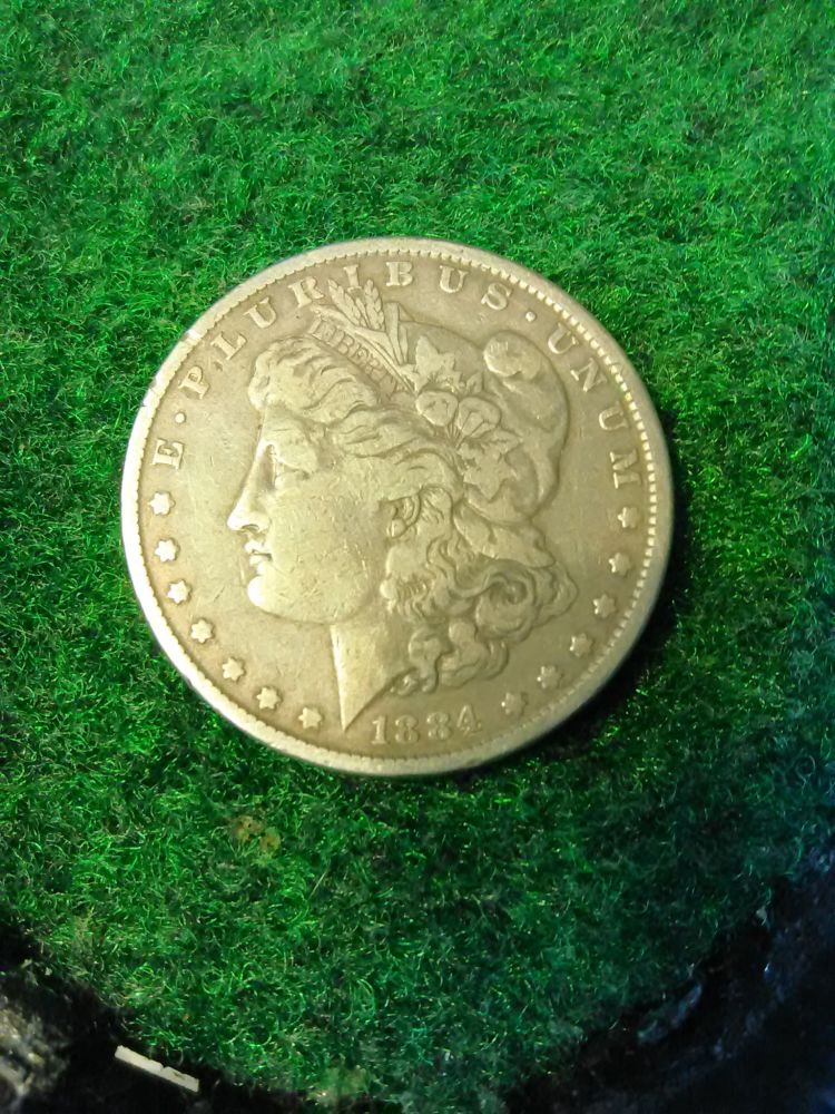 1884-Morgan-Peace-Dollar