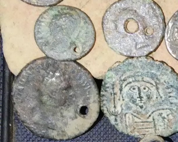 Holed-Coins-:-How-Much-Does-It-Lower-The-Value