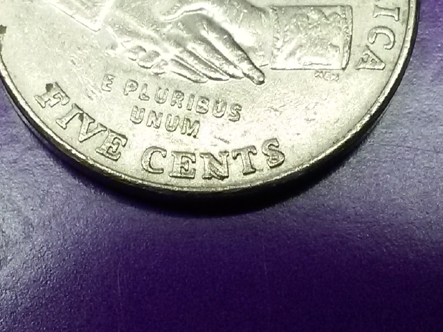 I-Have-A2004-P-Nickel-Are-These-Die-Chips-On-The-N-And-S-?