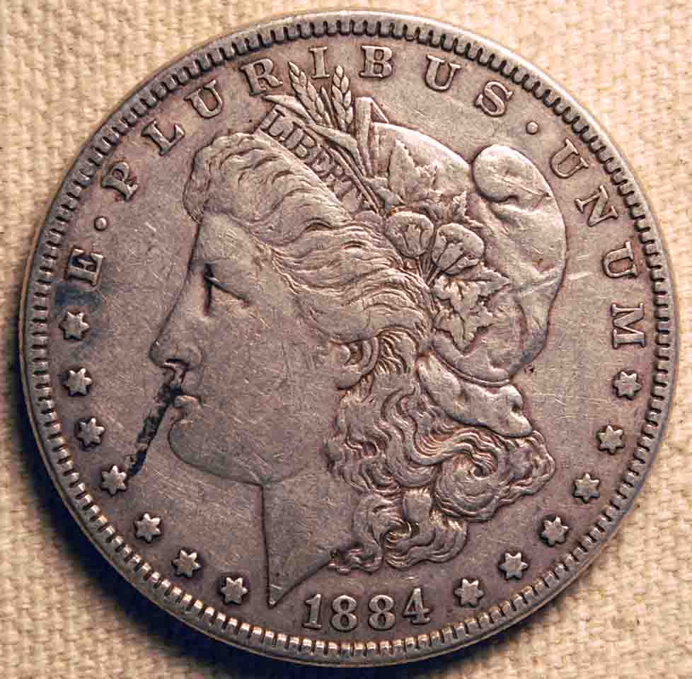 1884-Morgan-Dollar:--Lamination,-Or-Post-Mint-Damage?
