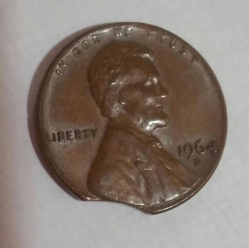 1964-D-Penny-With-A-Curved-Missing-Area-.