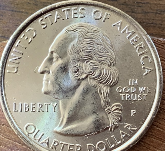 Die-Cracks-On-A-Quarter