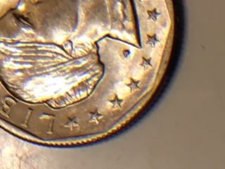Susan-B.-Anthony-Reeding-On-The-Obverse.