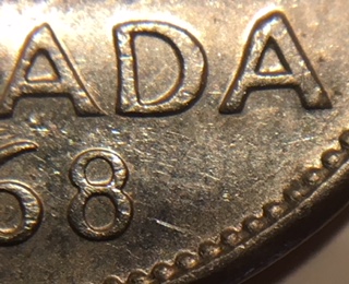 1968-Canadian-Nickel.-Doubling-On-The-Reverse.-Over-Abrated-Die?