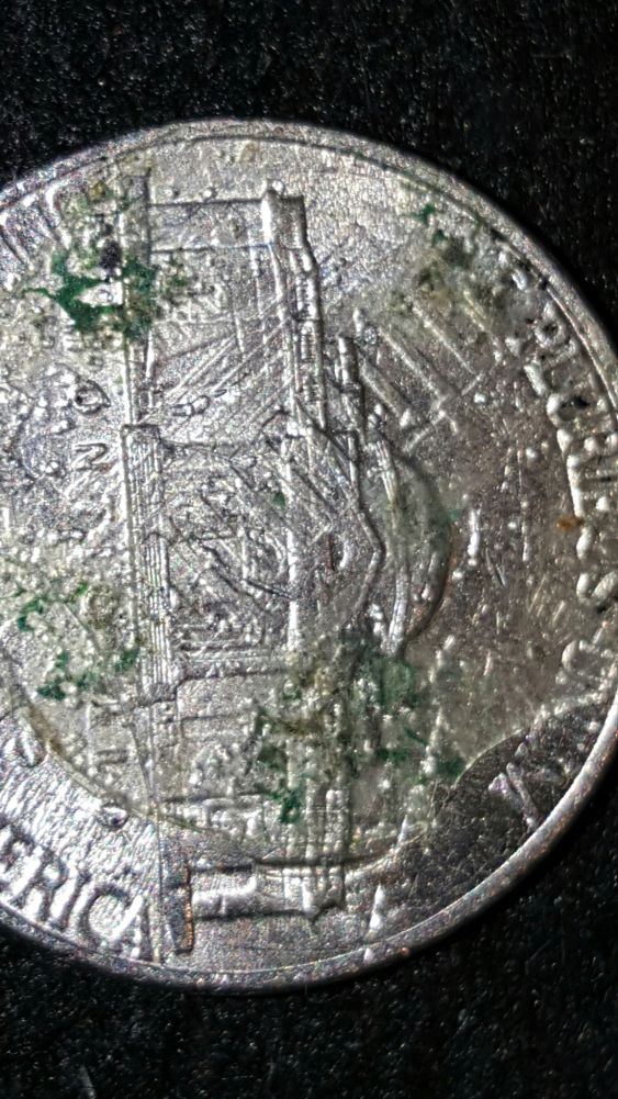 Lincoln-Cent-Stamped-On-Obverse-Side-Of-Jefferson-Nickel-While-Roll-Huntin