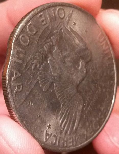 Is-This-A-Clipped-Planchet-Ike-Dollar?