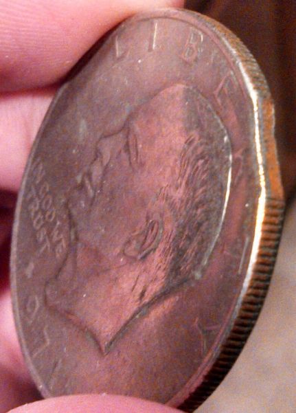 Is-This-A-Clipped-Planchet-Ike-Dollar?