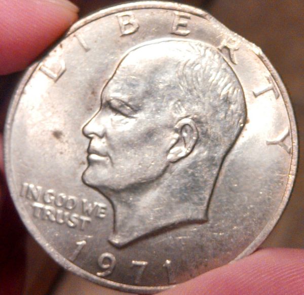 Is-This-A-Clipped-Planchet-Ike-Dollar?