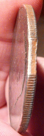 Is-This-A-Clipped-Planchet-Ike-Dollar?