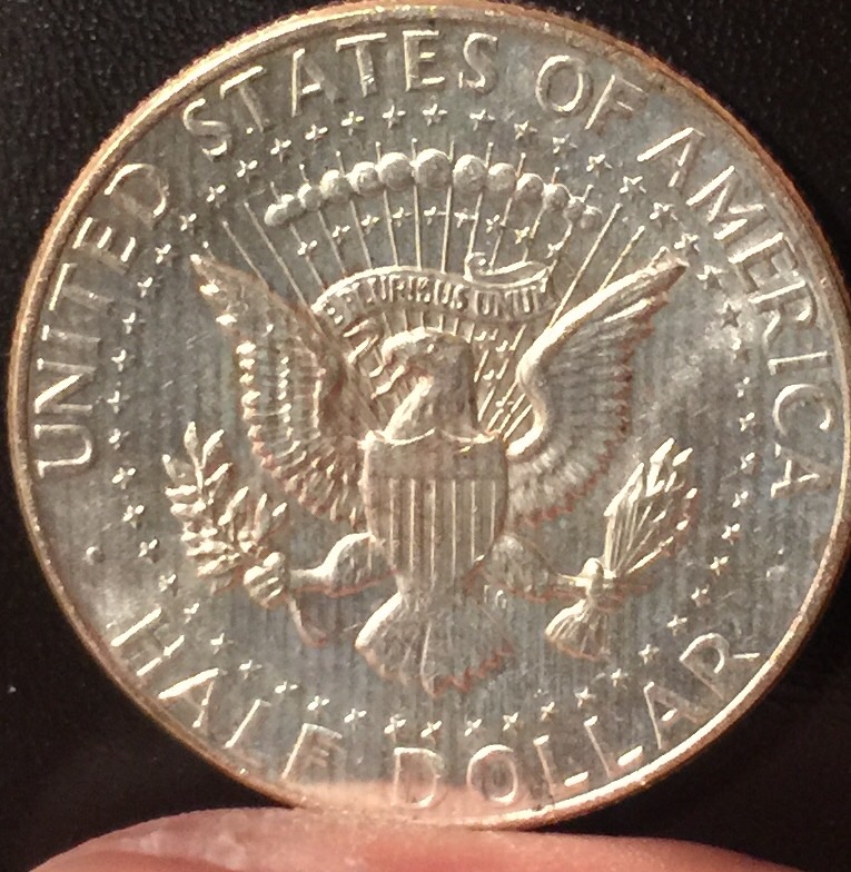 Why-Does-My-1964-Silver-Coin-Have-Streaks-Running-Down-On-Both-Sides