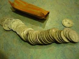 Roll-Of-Silver-Coins-From-Bank-Teller