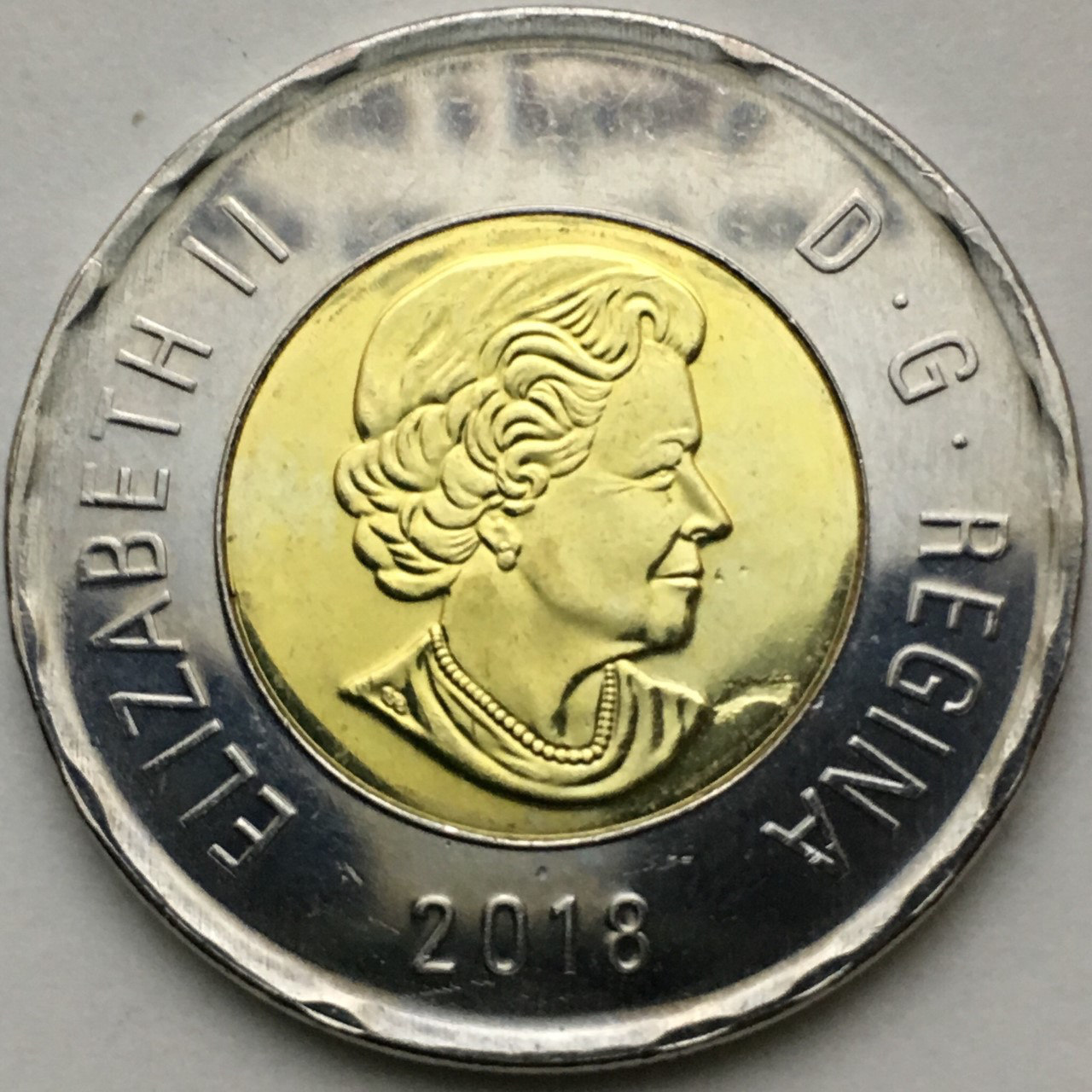 Help-Grading-My-2018-Toonie-With-Big-Strike-Through-&-Dot-Above-Date