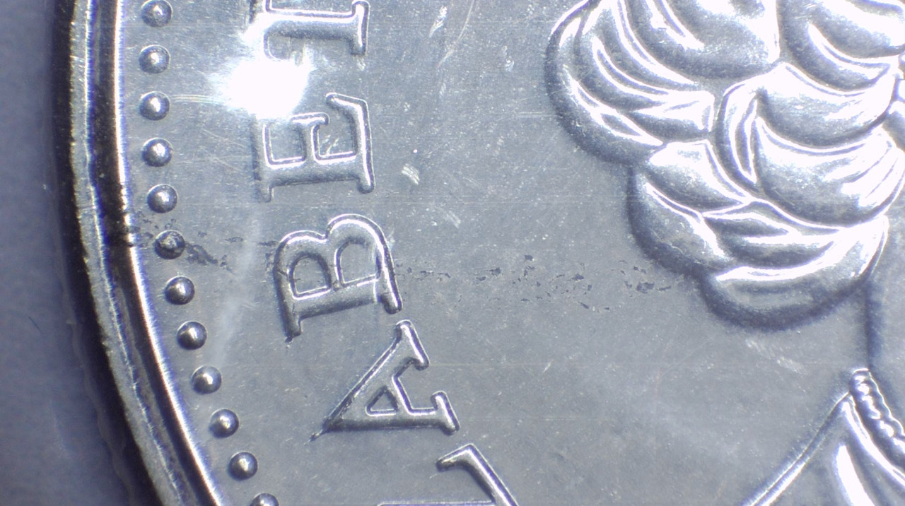 2021-50-Cents-Queen-Version,-Obverse-Struck-Through-Retained-Grease?