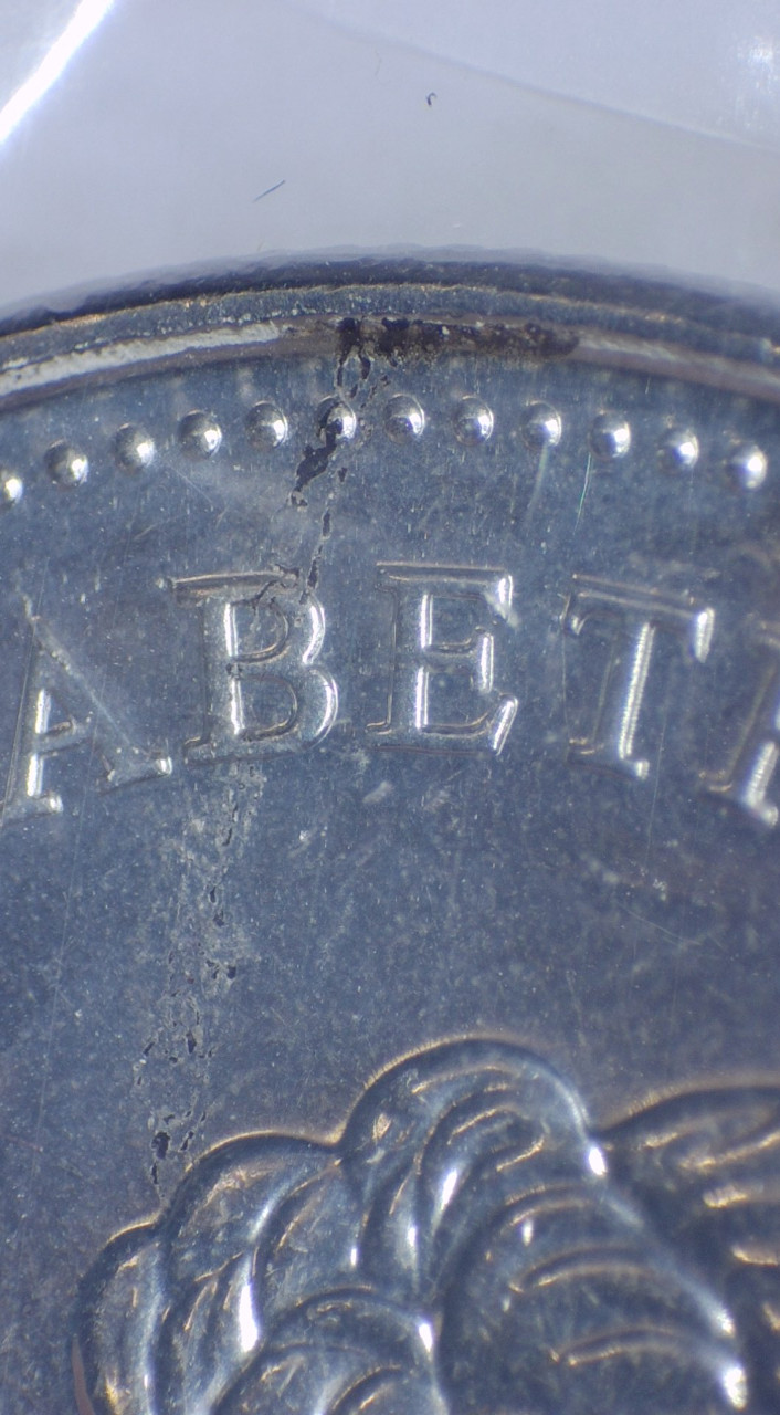 2021-50-Cents-Queen-Version,-Obverse-Struck-Through-Retained-Grease?