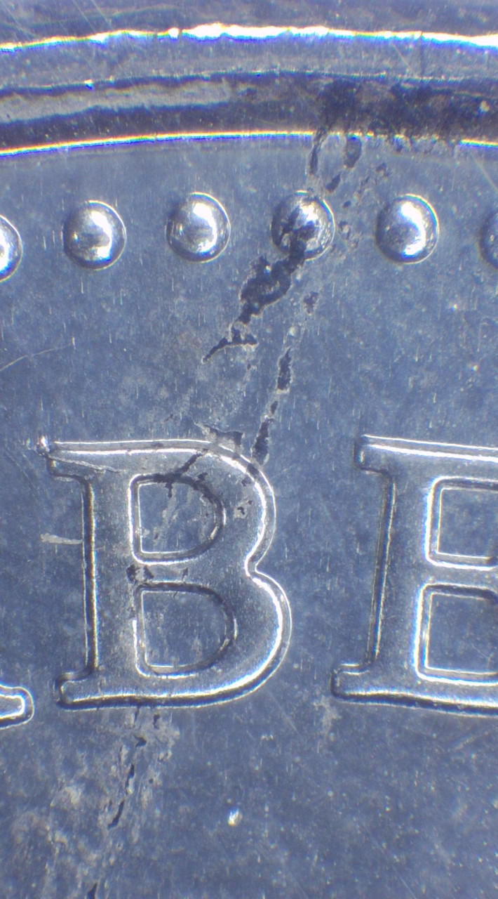 2021-50-Cents-Queen-Version,-Obverse-Struck-Through-Retained-Grease?