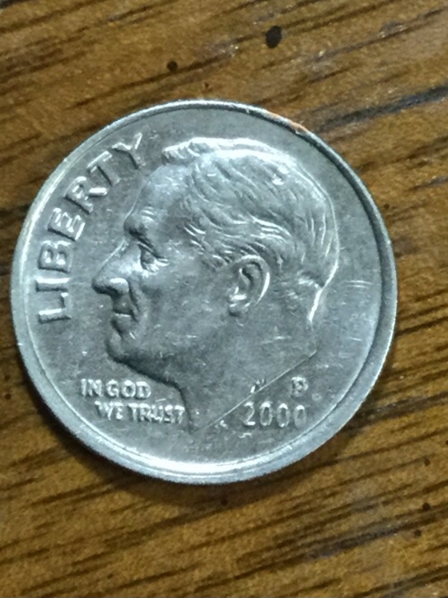 Anything-Strange-On-About-The-Rim-Of-This-2000-Dime?-It-Appears-Off-Center?