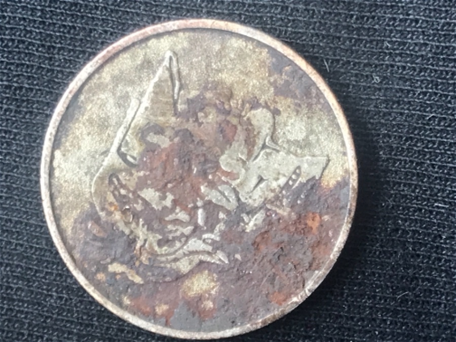 Weird-Coin-Found-In-Pocket-Change