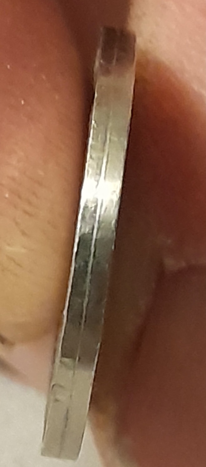 Jefferson-Nickel-Weighing-Light-With-A-Seam-On-Outer-Edge