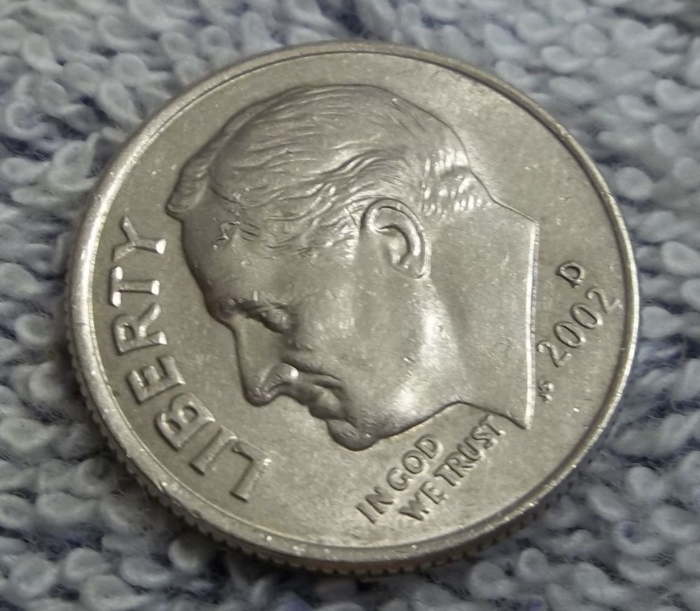 Found-Something-On-Forehead-Of-Roosevelt-Dime