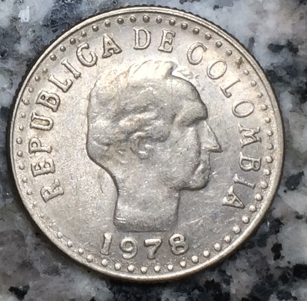 MD-In-Letters-And-Circular-Dots--Near-The-Edge-Of-This-Argentinian-Coin-?