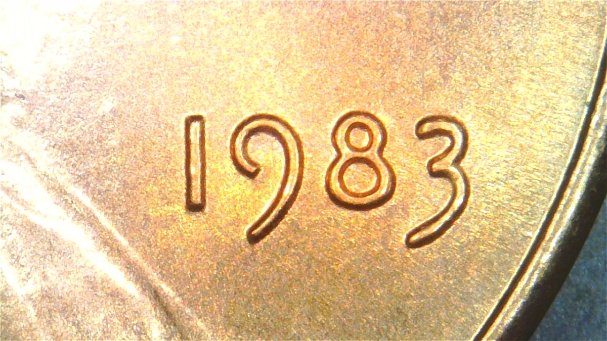 1983-LMC-Extra-Partial-E-On-Rim-Of-We-On-Obverse