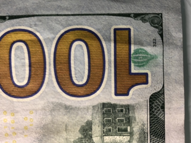 100-Dollar-Bill-Reverse-Bottom-Right-Corner-Has-An-Unknown-Print