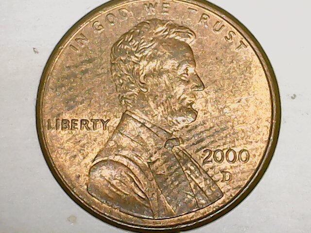 What-Causes-These-Lines-To-Form-On-A-Coin?-And-Why-Do-They-Show-Up-Kinda-Black-To-The-Naked-Eye?