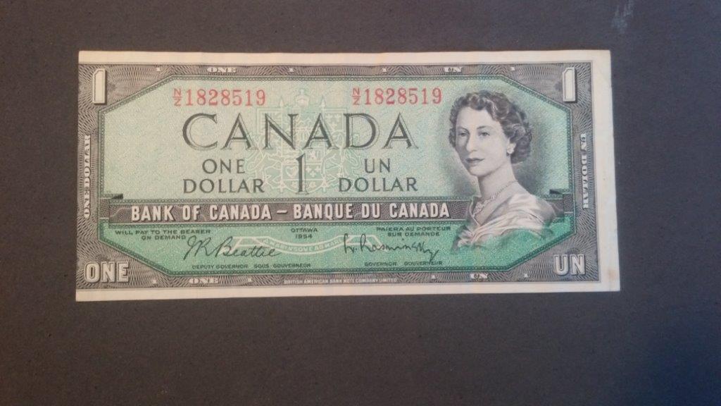 Unevenly-Cut-Or-Misaligned-Printing--$1-Bill-Question