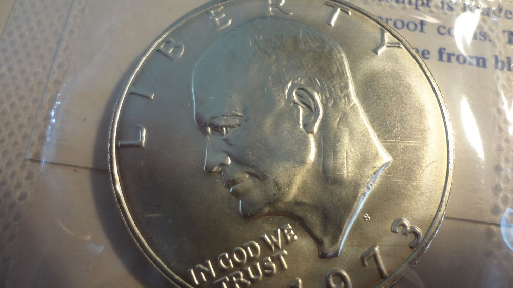 Blue-Eisenhower-Ike-Dollars-Original-Packaging-Vs-Professional-Grading