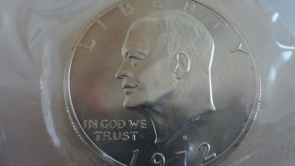 Blue-Eisenhower-Ike-Dollars-Original-Packaging-Vs-Professional-Grading