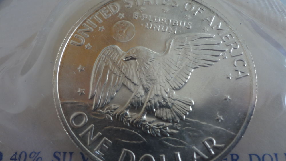 Blue-Eisenhower-Ike-Dollars-Original-Packaging-Vs-Professional-Grading