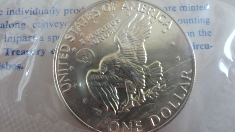 Blue-Eisenhower-Ike-Dollars-Original-Packaging-Vs-Professional-Grading