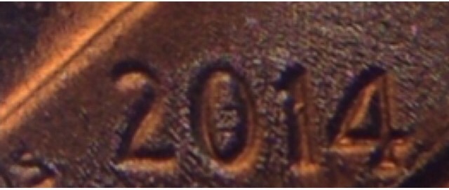 Trying-To-Figure-Out-What's-Happening-With-This-2014-Dime?