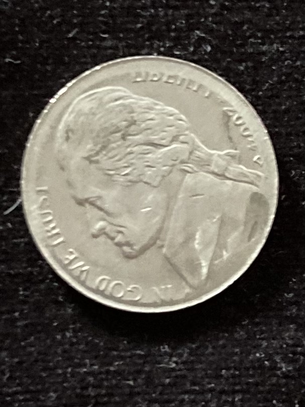 2004-Nickel.----Mint-Error-Or-Human-Done?-The-Spot-Where-The-Image-Is-Supposed-To-Be-Is-Raised-But