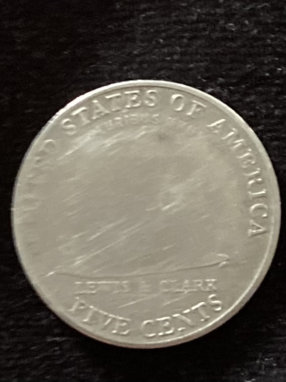 2004-Nickel.----Mint-Error-Or-Human-Done?-The-Spot-Where-The-Image-Is-Supposed-To-Be-Is-Raised-But