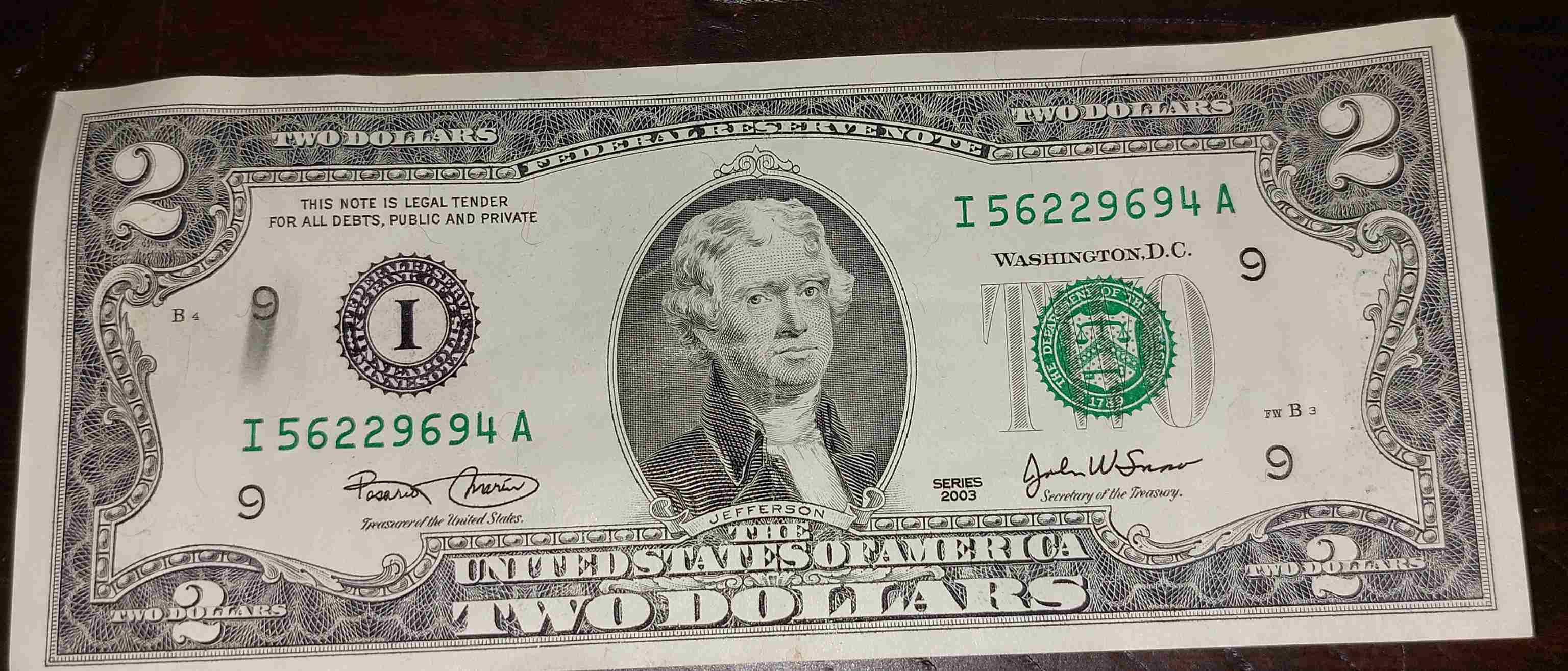2$-Bill-With-Smudge-On-Left-And-Ink-Bleed-Through-On-Right