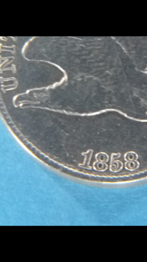 1858/7-Eagle-Clashed-With-20?-Gold?-Interesting-Coin-Here