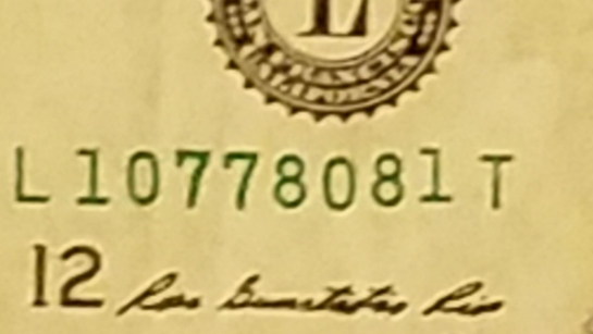Uneven-Serial-Number-On-A-1-Dollar-Bill