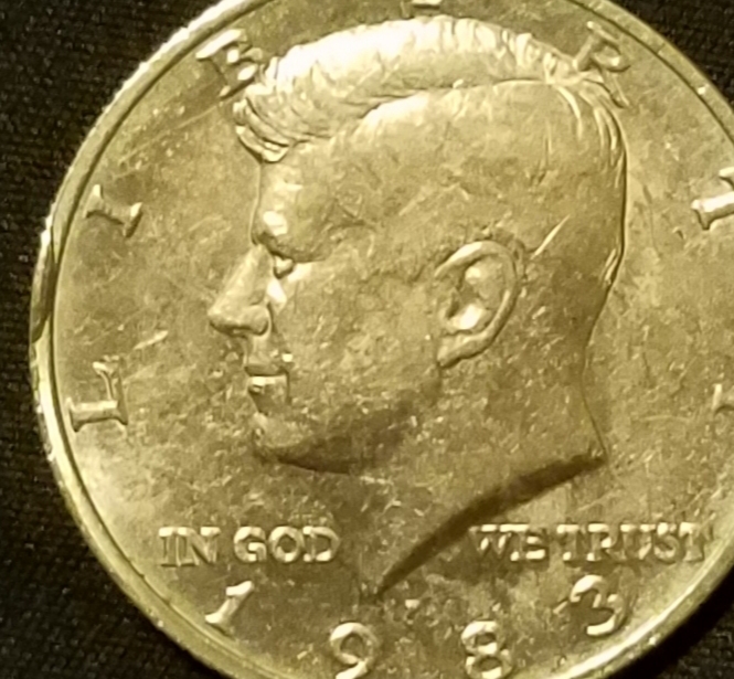 1983-Kennedy-Half-With-Cud-On-Rim?
