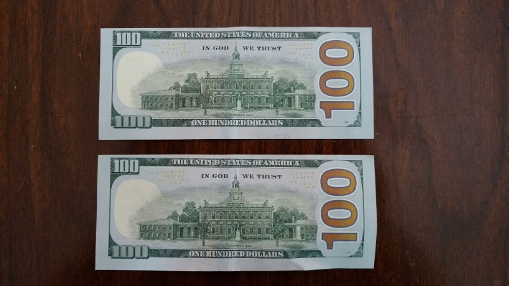 Miscut-2009A-$100-Bills