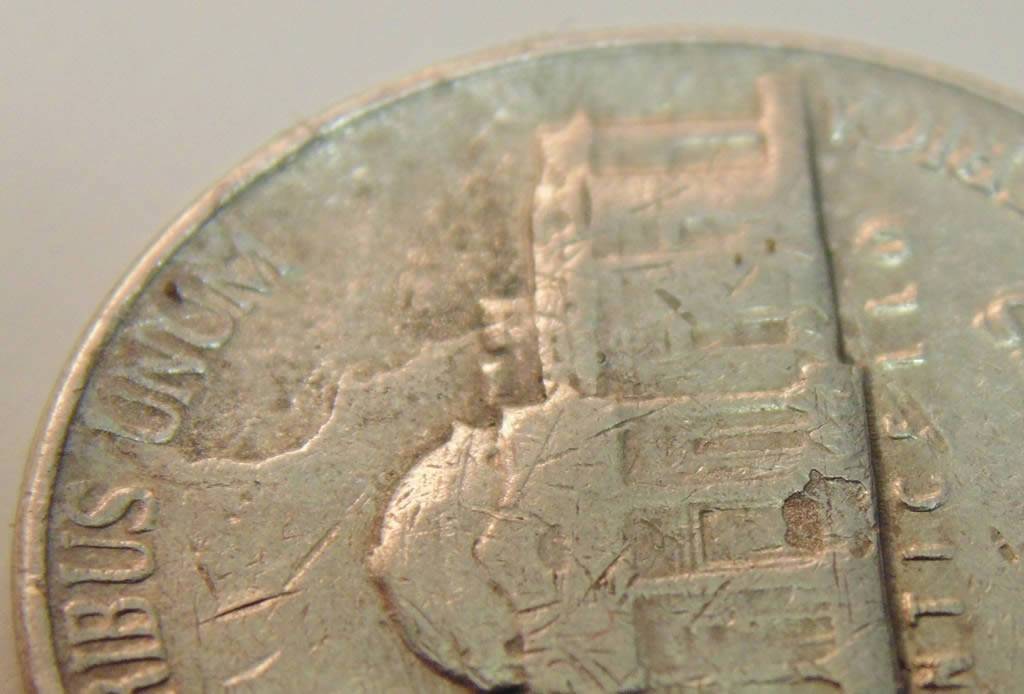 Multiple-Strike-Through-Nickel-Or-Enviro-Damage?