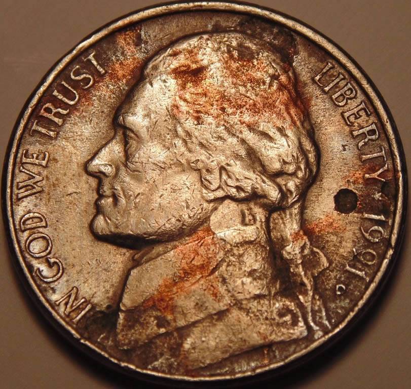 1991-D-Nickel,-Stike-Through,-Enviro,-Lam,-Or-Something-Else?
