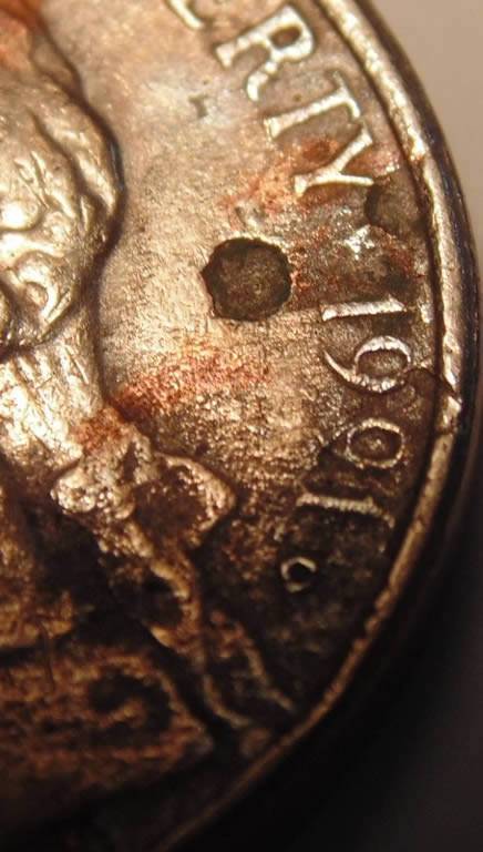 1991-D-Nickel,-Stike-Through,-Enviro,-Lam,-Or-Something-Else?