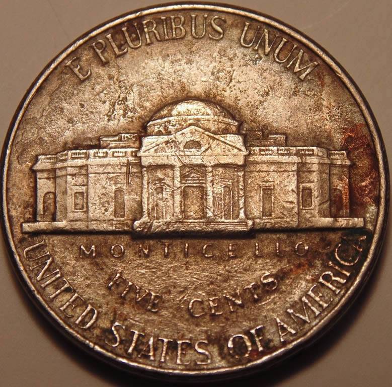 1991-D-Nickel,-Stike-Through,-Enviro,-Lam,-Or-Something-Else?