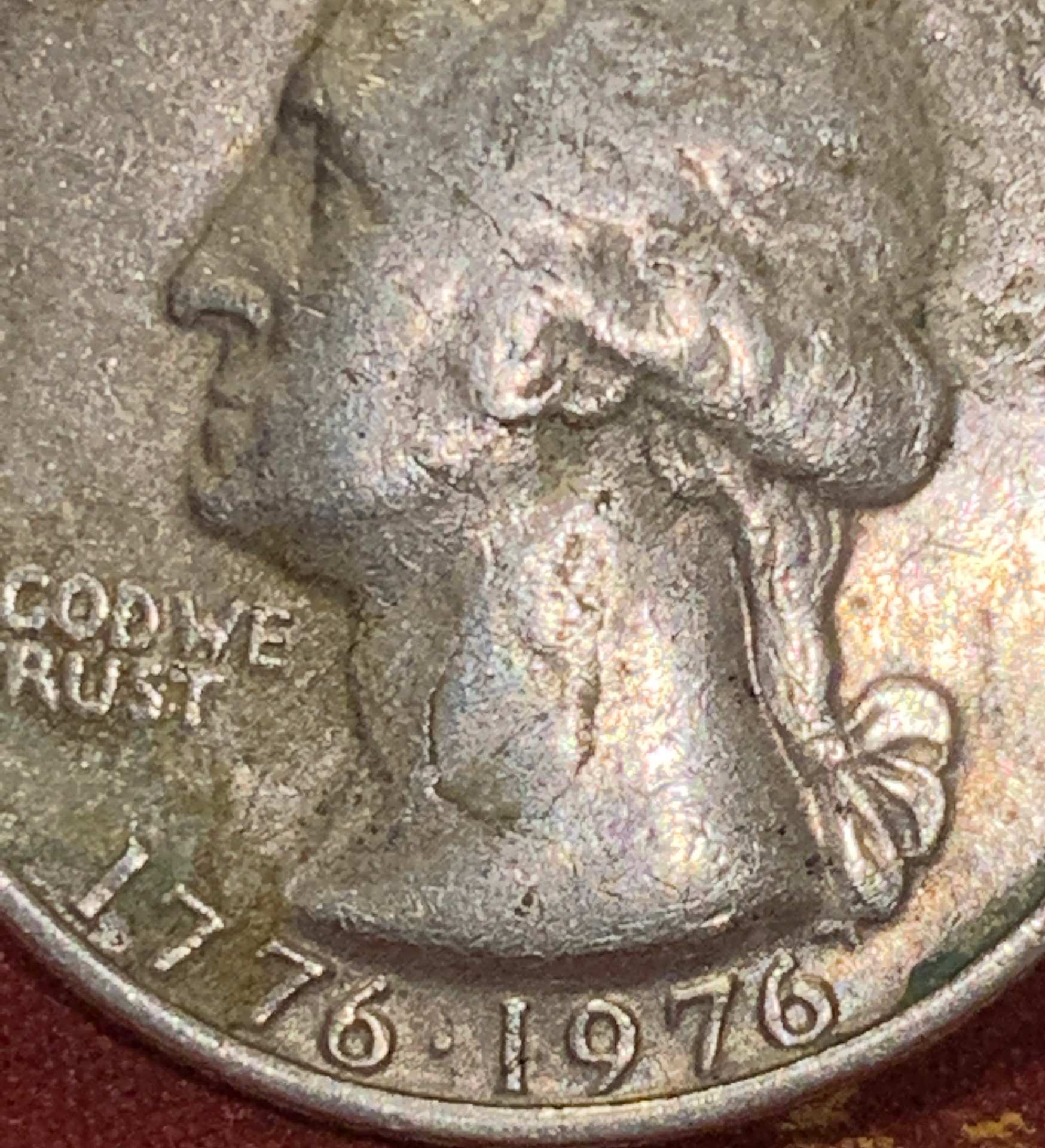 1976-Bicentennial-Quarter,-Badly-Battered.-Is-It-Damaged-From-The-Mint-Or-Old-Age?