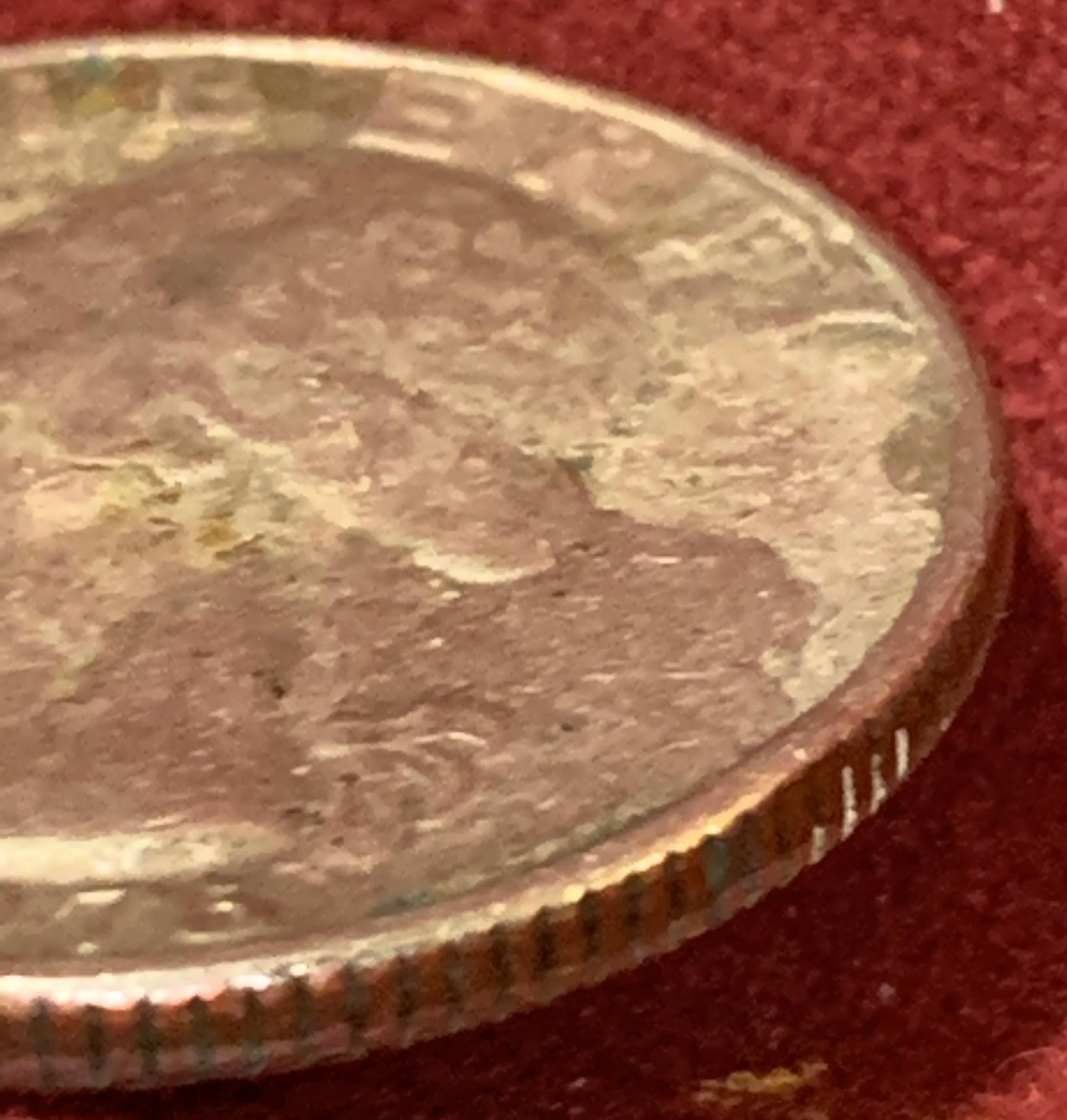1976-Bicentennial-Quarter,-Badly-Battered.-Is-It-Damaged-From-The-Mint-Or-Old-Age?