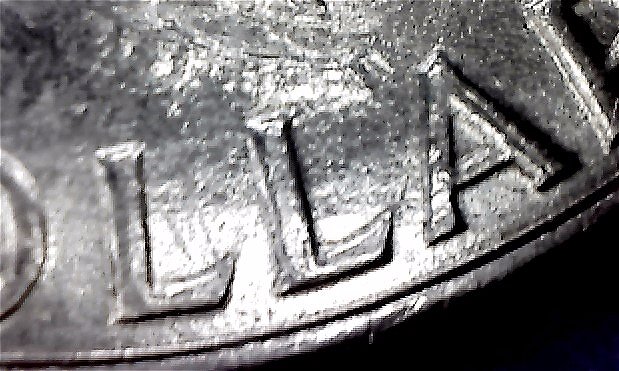 1971-Ike-Dollar-With-Something-Underneath-The-Strike?-Doubling-As-Well-Help