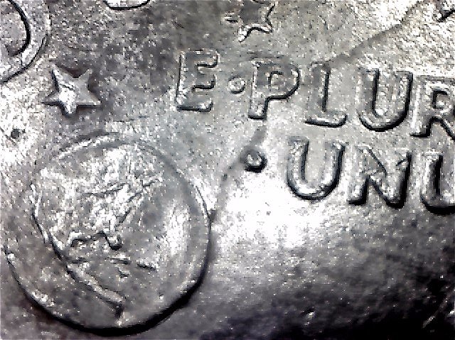 1971-Ike-Dollar-With-Something-Underneath-The-Strike?-Doubling-As-Well-Help